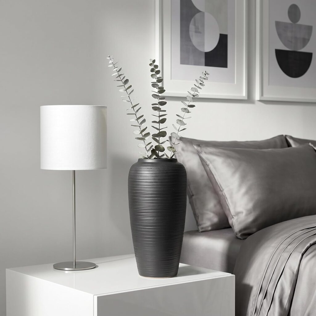 Black ribbed vase styling for modern bedroom nightstand aesthetic